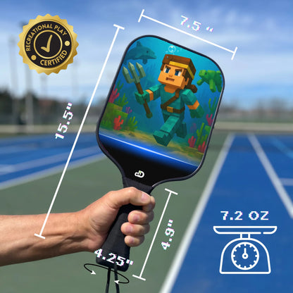 Pickleball paddle with Minecraft character design, held by a hand, on a tennis court background.